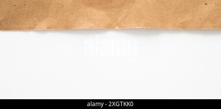 Brown Paper Torn Edge on White Background Stock Photo