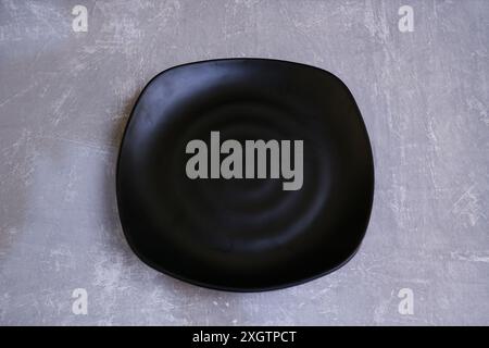 black plate on the gray background great for food photography Stock Photo