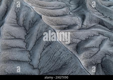 Striking aerial shot capturing the intricate patterns and textures formed by weathered canyons in Hanksville, Utah, showcasing a natural, abstract lan Stock Photo