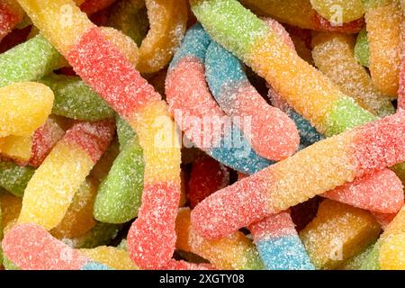 a close-up of colorful, sugar-coated gummy worms Stock Photo