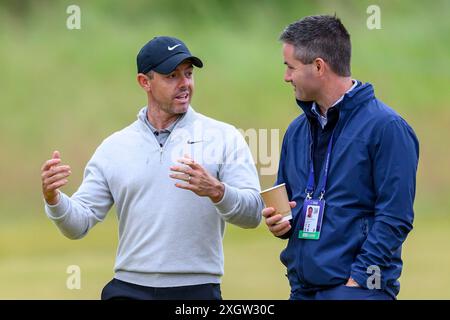 Rory McIlroy speaks with his manager, Sean O'Flaherty, during The ...