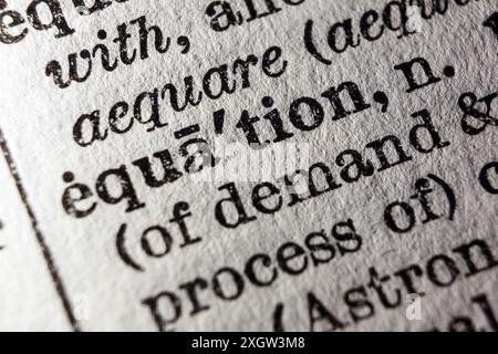Word equation on dictionary page, macro close-up Stock Photo