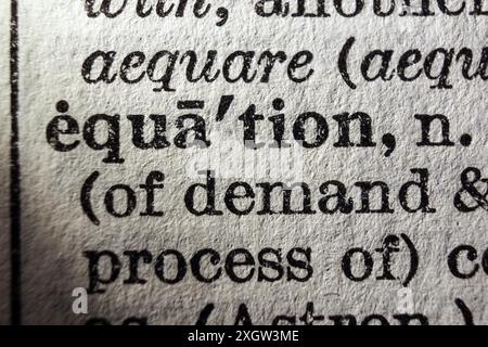Word equation on dictionary page, macro close-up Stock Photo