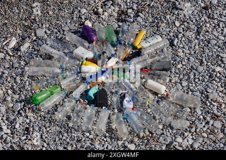 Spiralling out of control.  Spiral design of plastic bottles collected from one small beach on Peristera, Northern Sporades, Aegean Sea, Greece Stock Photo