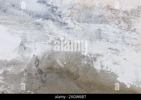 Tile or stone surface in neutral grey , white and brown colors. Art cement texture background with frozen smudges of paint. Plastered concrete wall Stock Photo