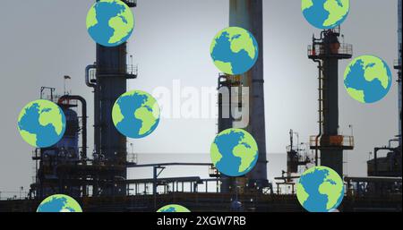 Image of falling globes over refinery. Global business, finances, data processing and digital interface concept digitally generated image. Stock Photo