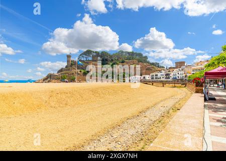 View of the medieval Murallas de Tossa de Mar fortified castle of the sandy beach and whitewashed town of Tossa de Mar, Spain, Costa Brava coast. Stock Photo