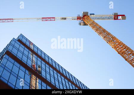 Construction Crane and Modern Office Building Stock Photo