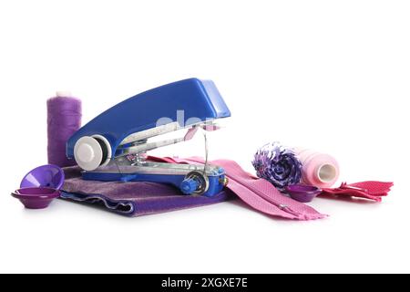 Manual sewing machine with thread spools, zippers and buttons isolated on white background Stock Photo