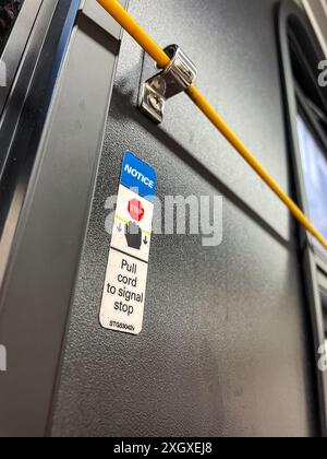 Close up of a New York City MTA signal stop chord in the interior of a bus, 2024, USA Stock Photo