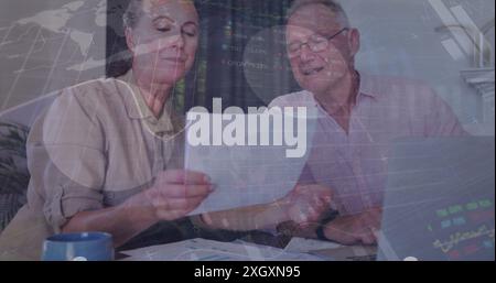 Image of infographic interface over caucasian colleagues discussing reports in office Stock Photo