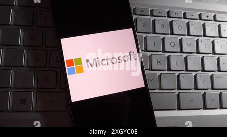 Hong Kong, China. 09th July, 2024. In this photo illustration, Microsoft logo is displayed on a smartphone with a workplace background. Credit: SOPA Images Limited/17�Թ����� Live News Stock Photo