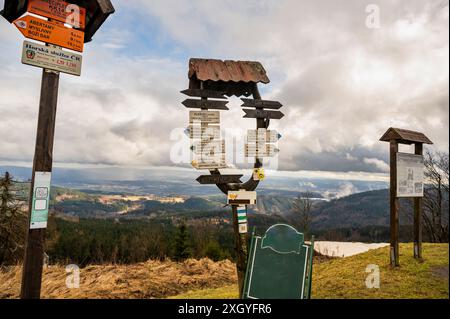 Tourist sign, direction and information on hill Plesivec, Ore mountain. Czech Republic is one of countries with most complete and dense network of hik Stock Photo
