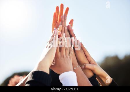 Hand together, solidarity and synergy with unity as university students or colleagues for movement. Group of people, diversity and community for Stock Photo