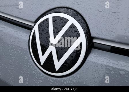 new volkswagen vw logo badge on grey car Stock Photo