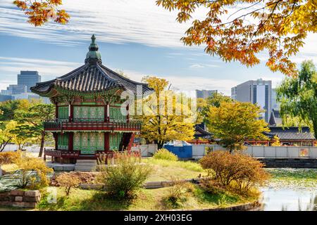 Autumn view of Hyangwonjeong Pavilion on an artificial island of lake at Gyeongbokgung Palace in Seoul, South Korea. Fantastic cityscape. Stock Photo