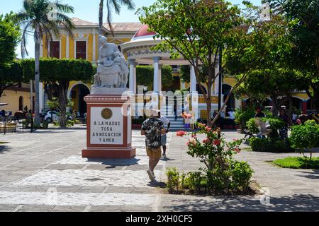 Granada, Nicaragua - March 24, 2019: A leisurely stroll by the historical monument in the city’s vibrant park. Stock Photo