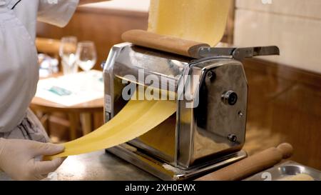 Chef making fresh italian traditional pastry for pasta in a restaurant. Stock Photo
