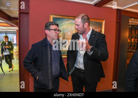 Mayor of Greater Manchester Andy Burnham, pictured with former Welsh Rugby captain Alyn Wyn Jones during an event at Penderyn distillery in Swansea. Stock Photo