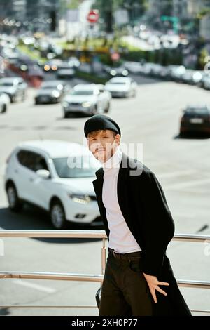 Young red-haired man in debonair attire strolling through the city. Stock Photo