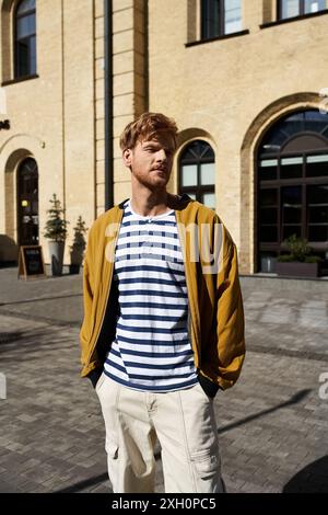 Stylish man in debonair attire gazing at architectural beauty. Stock Photo