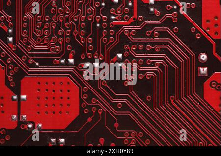 Macro image of a red printed circuit board. technology background Stock Photo