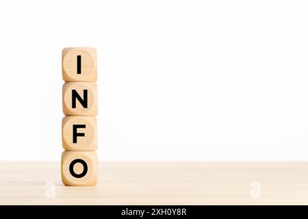 INFO text on a pile of wooden blocks on table. Copy space Stock Photo