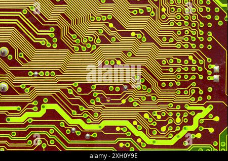 Macro image of a red printed circuit board. technology background Stock Photo