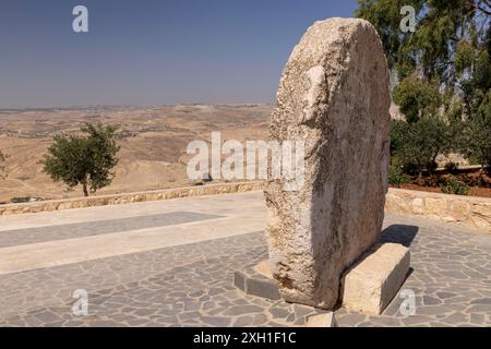 Rolling stone as a fortified Tor tor of a Byzantine monastery in the ancient village of Faysaliyah, known as Kufer Abu Badd, Mount Nebo (Jabal Stock Photo