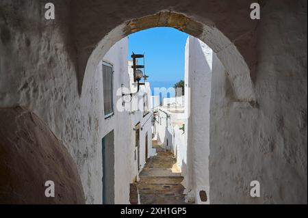 Narrow passageway with arches in a medieval town overlooking the sea, Chora, main town of Patmos, Patmos, Old Town, Dodecanese, Greek Islands, Greece Stock Photo