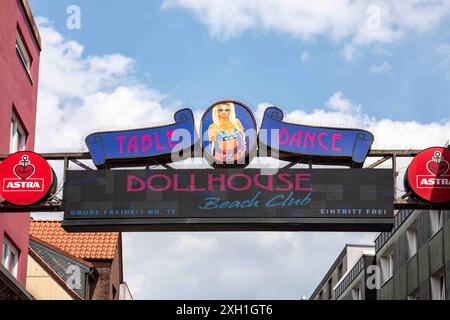 Dollhouse Beach Club cabinet signs over Grosse Freiheit on day time in Reeperbahn area of St. Pauli, Hamburg, Germany Stock Photo