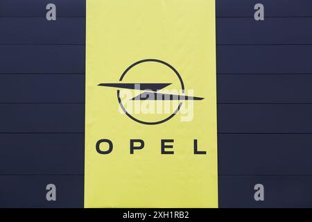 Villefranche, France - February 25, 2024: Opel logo on a wall. Opel is a german automobile manufacturer headquartered in Russelsheim, Germany Stock Photo