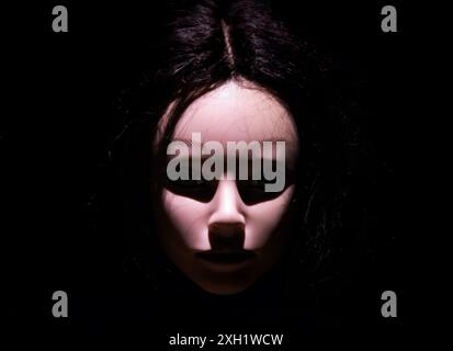 Demonic Halloween doll face scary spooky eerie decoration. Stock Photo