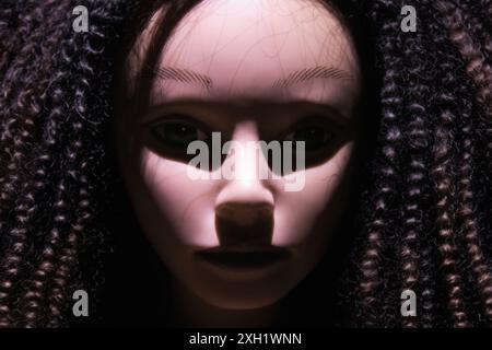Demonic Halloween doll face scary spooky eerie decoration. Stock Photo