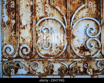 Old rusty decorated metal fence close up outdoors Stock Photo