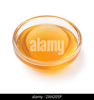 Glass bowl with sweet natural honey as an ingredient isolated on white background close up Stock Photo
