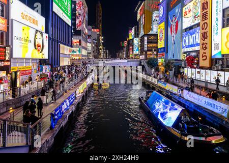 OSAKA/JAPAN - November 23, 2023: dotonbori canal at night with illuminated billboards Stock Photo