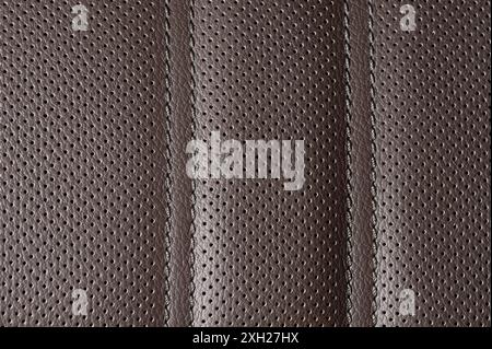 Brown perforated leather with stitches macro close up view Stock Photo