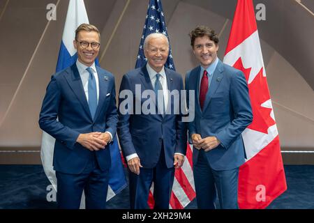 Washington, United States. 10th July, 2024. U.S President Joe Biden, center, poses with Canadian Prime Minister Justin Trudeau, right, and Finnish President Alexander Stubb following the North Atlantic Council meeting of the 75th anniversary NATO Summit at the Walter E. Washington Convention Center, July 10, 2024 in Washington, DC Credit: Adam Schultz/White House Photo/Alamy Live News Stock Photo