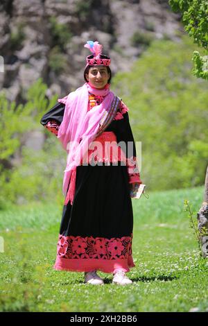 Portrait image of Kalash tribe girl in tradditional costume from rumbur village, kalash valley chitral, pakistan. Stock Photo