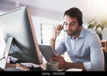 Call center, customer support and man on computer with tablet for research, online help and consulting. Corporate, telemarketing and person on digital Stock Photo