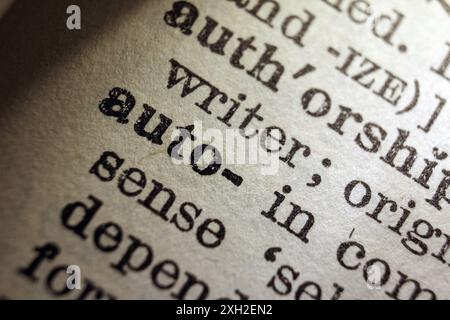 Words auto and writer on dictionary page, macro close-up Stock Photo