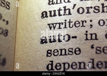 Words auto and writer on dictionary page, macro close-up Stock Photo