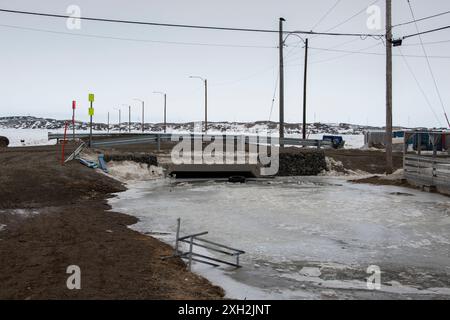 Frozen river on Sinaa Street in Iqaluit, Nunavut, Canada Stock Photo