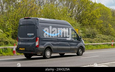 Bristol, England, UK - 28 April 2024: Delivery van used by Amazon Prime driving on a road on the outskirts of Bristol Stock Photo