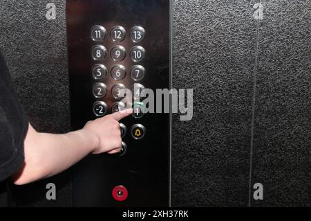 Freight elevator The girl presses the button in the elevator Samara Samara region Russia Copyright: xSvetlanaxVozmilovax Vozmilova5293 Stock Photo