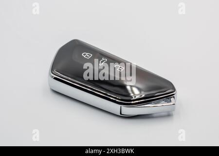 Modern new car proximity key closeup on white Stock Photo