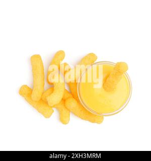 Bowl with cheese sauce and tasty corn sticks on white background Stock Photo