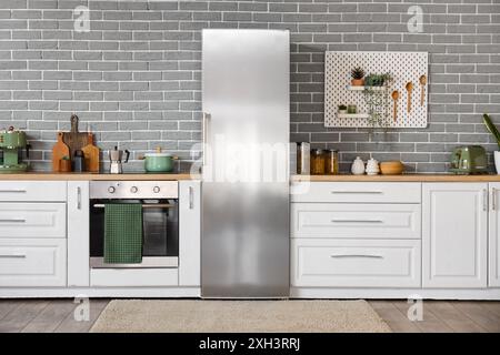 Interior of kitchen with stylish fridge, counters and utensils Stock ...