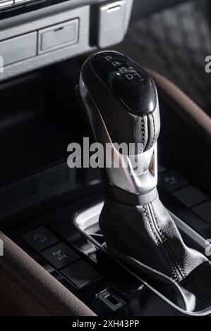 Automatic gearstick with leather cover macro close up view Stock Photo